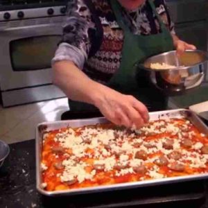 italian grandma makes pizza bread short version J3kZZCSxBn4