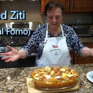 italian grandma makes baked ziti rigatoni pasta al forno AnyNZM1X73w