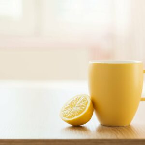 graphicstock cup of tea and lemon closeup with sunny house interior in background B0lhQtKnZW scaled 1
