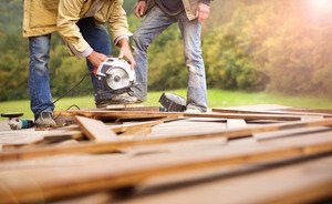 graphicstock detail of carpenters hand grinding wooden planks rCb3ATn3 thumb